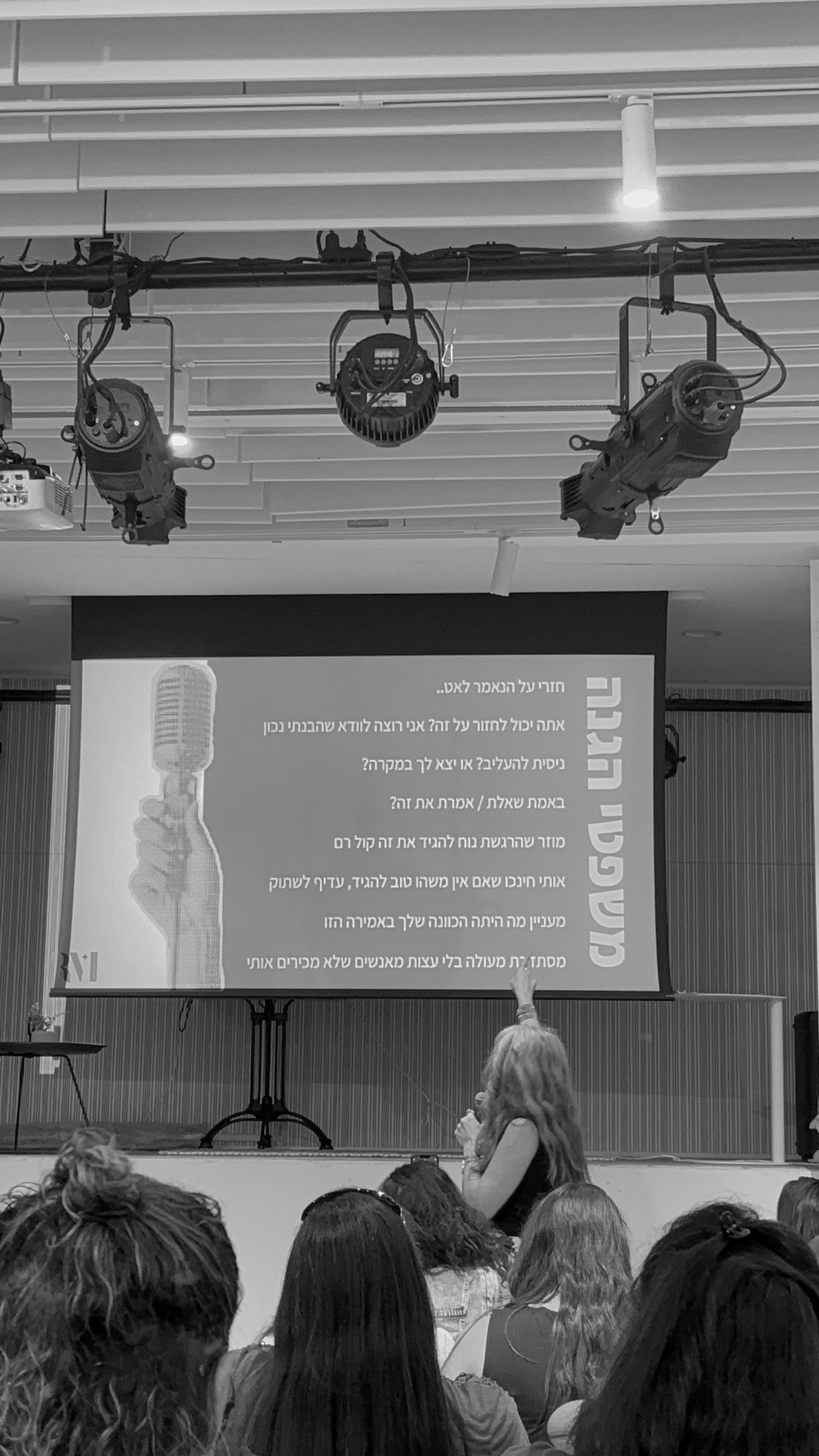 Workshop on verbal self-defense, audience watching a presentation