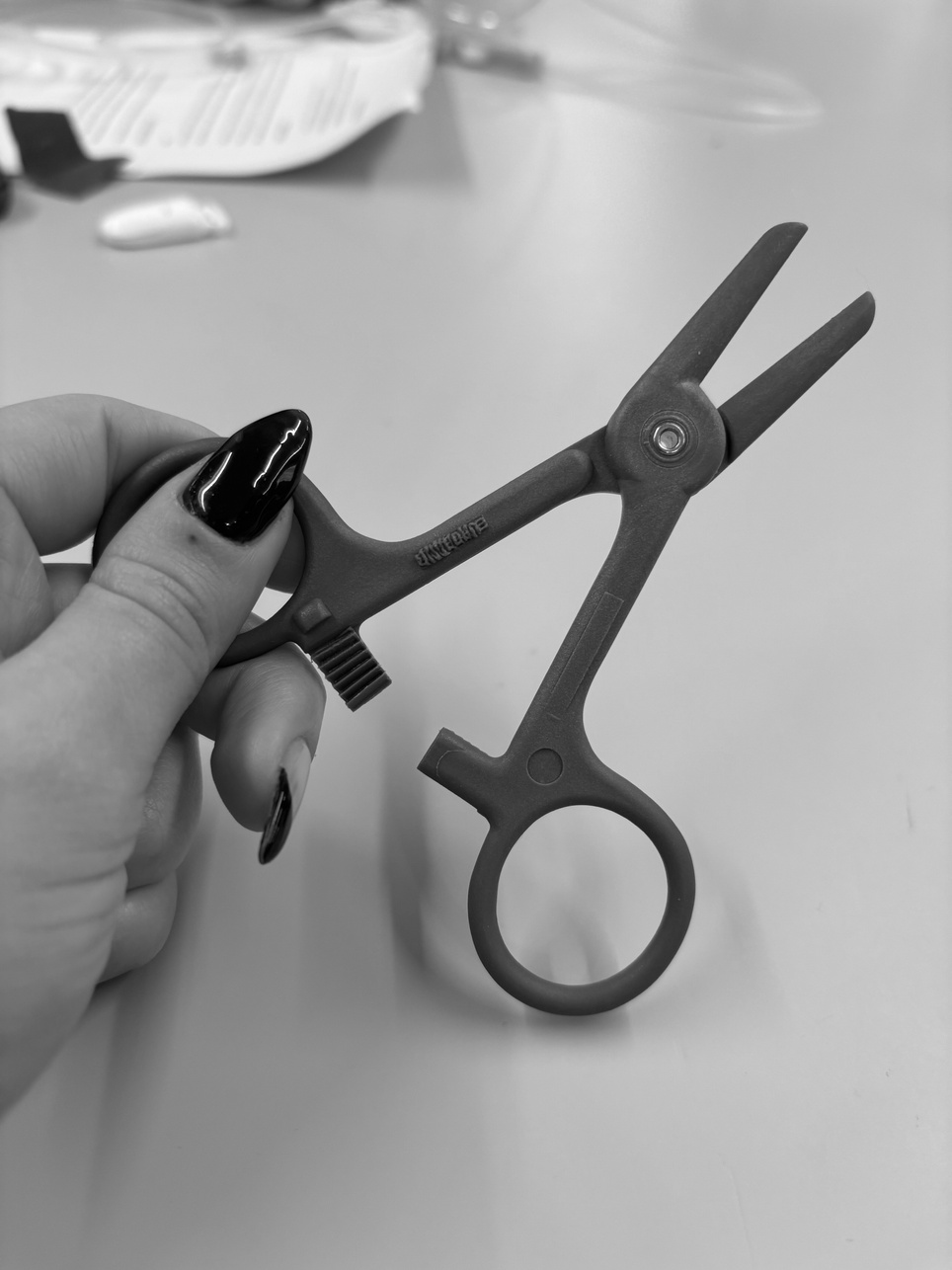 Close-up of the bulky improvised clamp previously used on the ward